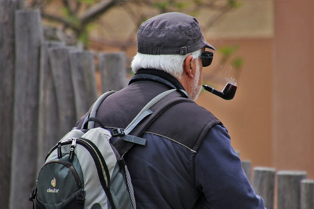 Older Man Smoking a Pipe, Needing to Poop